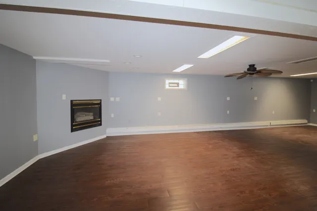 an empty room with a empty space and windows