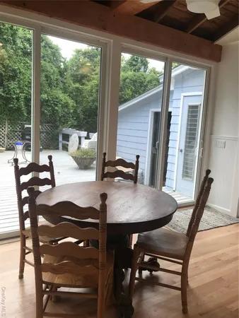 a view of a dining room with furniture window and outside view