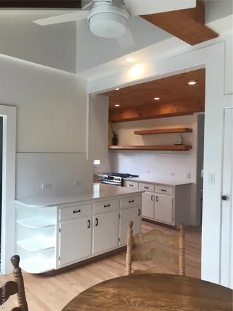 a kitchen with stainless steel appliances granite countertop a sink and cabinets