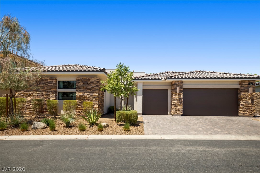 45 Garibaldi Way Henderson, NV 89011 - Photo 1 of 74 A desert-inspired landscape complements the striking stone and stucco facade of this modern residence.