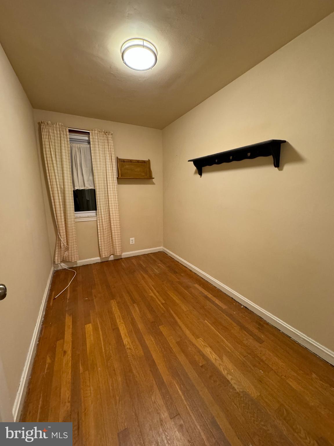 1513 Aldeney Avenue Middle River, MD 21220 - Photo 28 of 34 an empty room with wooden floor and windows