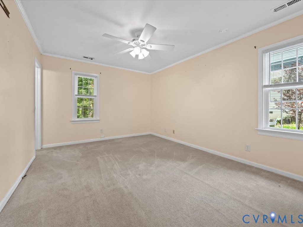 1430 Lockett Ridge Road Midlothian, VA 23114 - Photo 17 of 33 Carpeted empty room featuring crown molding and a