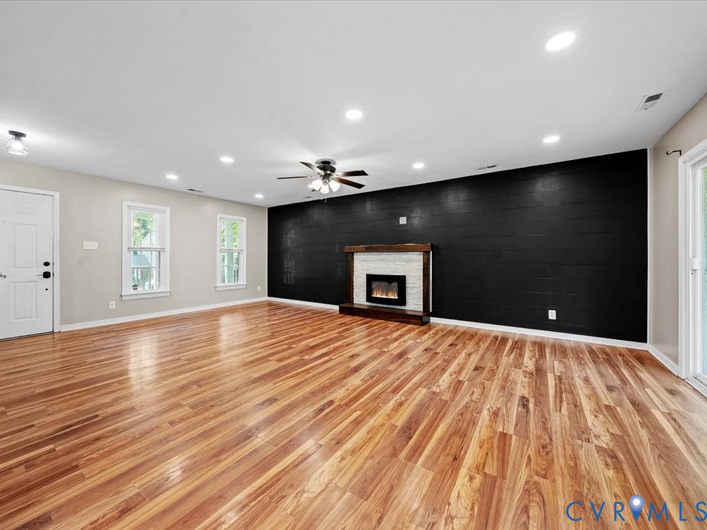 1430 Lockett Ridge Road Midlothian, VA 23114 - Photo 8 of 33 Unfurnished living room featuring an accent wall,