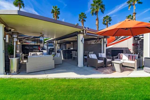 a view of a chair and table in the patio