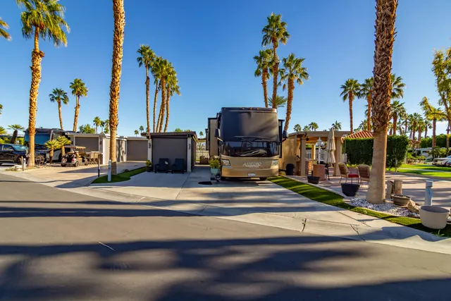 an aerial view of multiple houses with yard