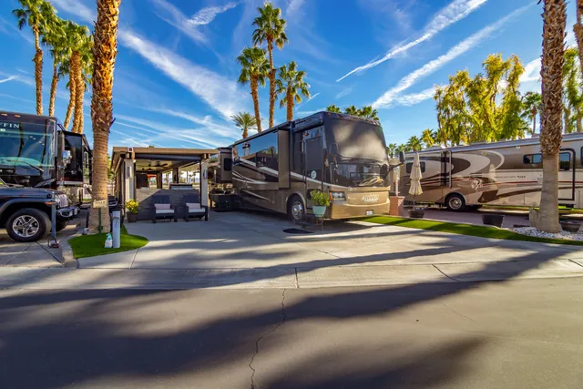 a kitchen with a stove a table and chairs in it