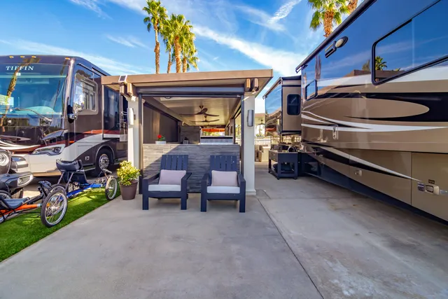 a kitchen with stainless steel appliances a stove a sink and a refrigerator