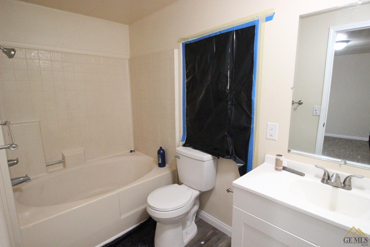 Undisclosed Address Bakersfield, CA 93308 - Photo 13 of 25 a bathroom with a sink a toilet and shower