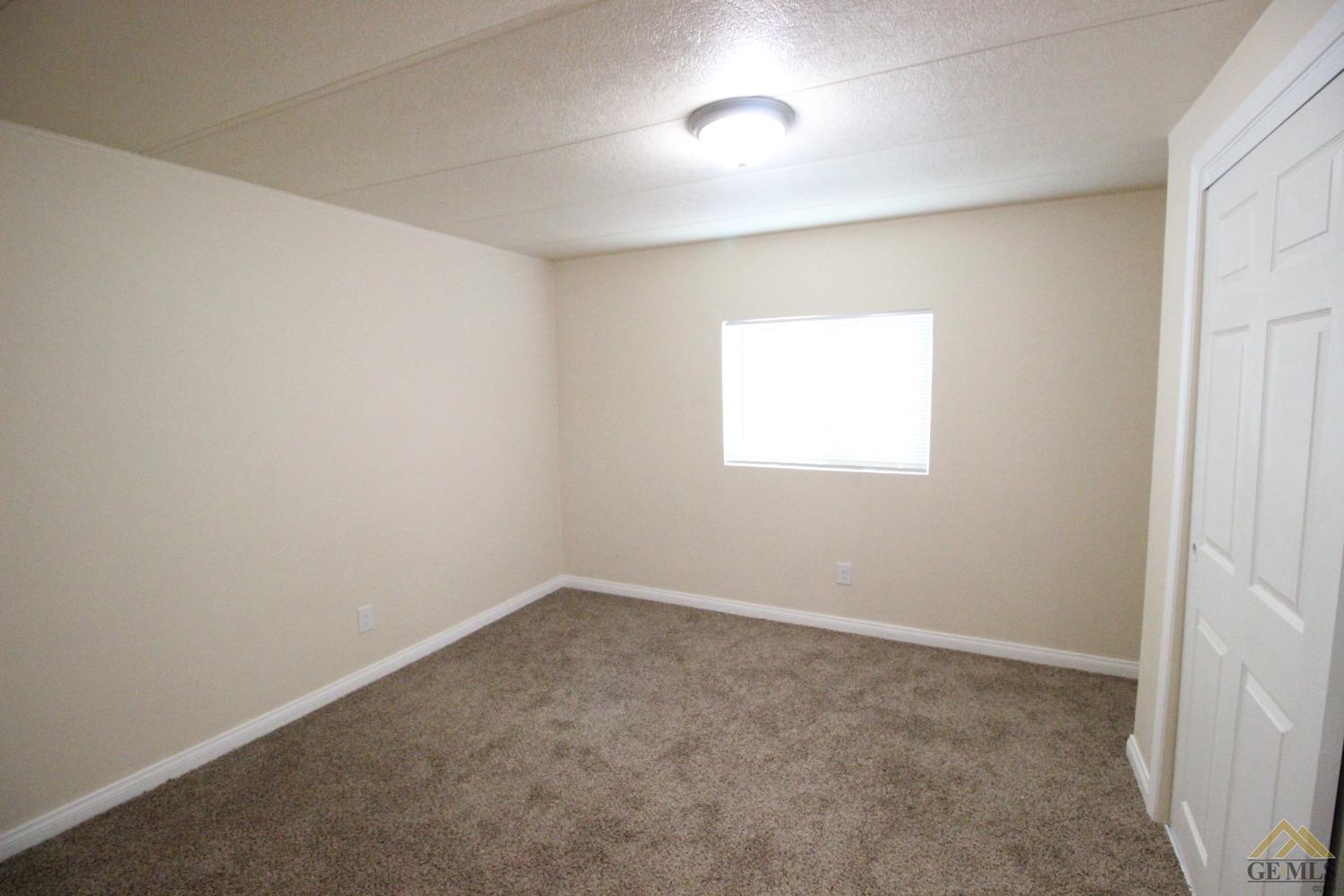 Undisclosed Address Bakersfield, CA 93308 - Photo 8 of 25 an empty room with a window