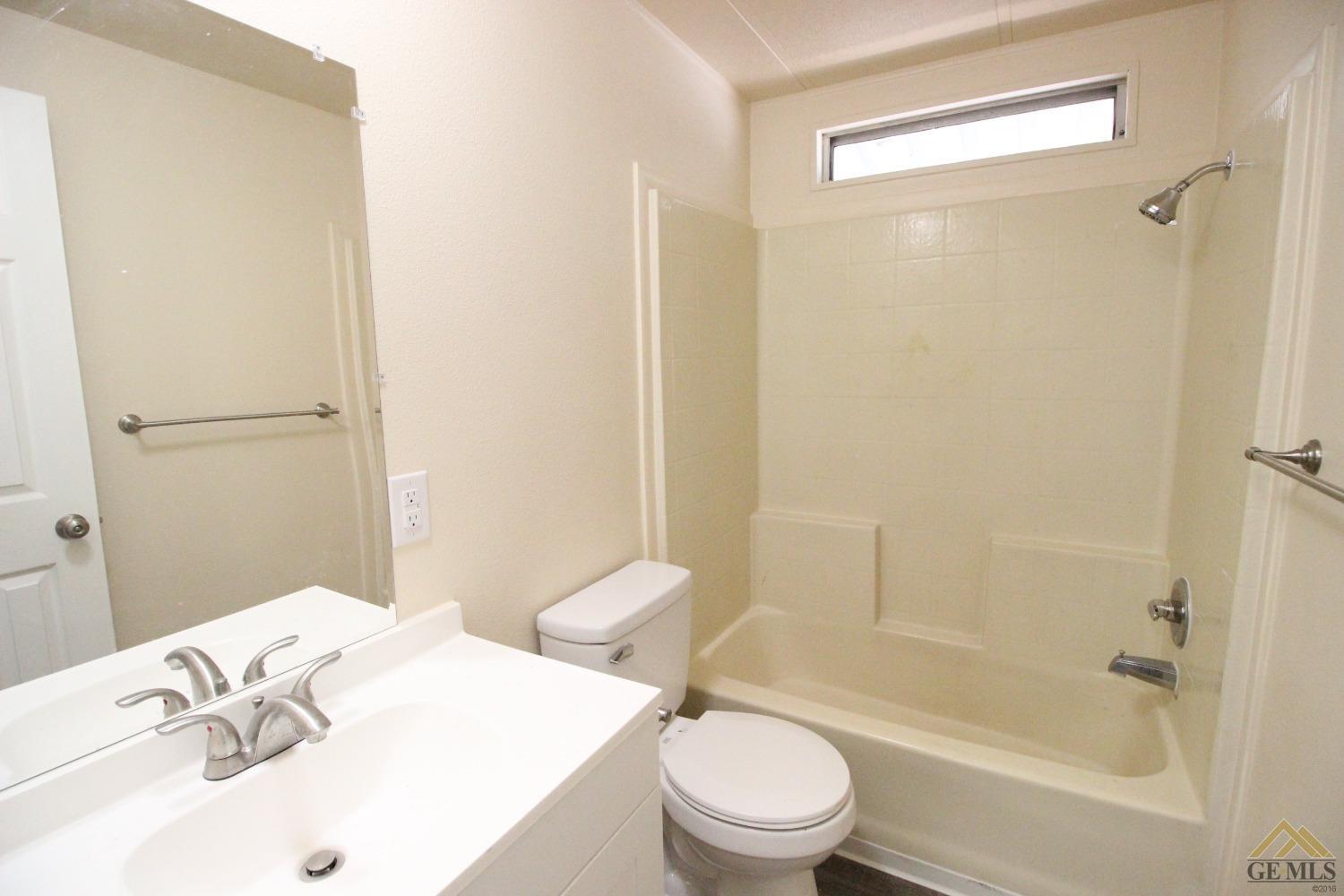 Undisclosed Address Bakersfield, CA 93308 - Photo 9 of 25 a bathroom with a sink toilet and shower