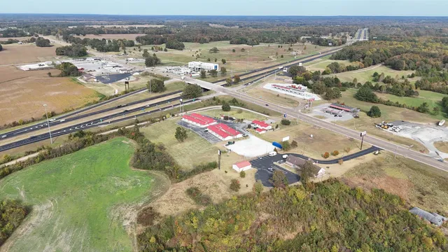an aerial view of residential houses with outdoor space
