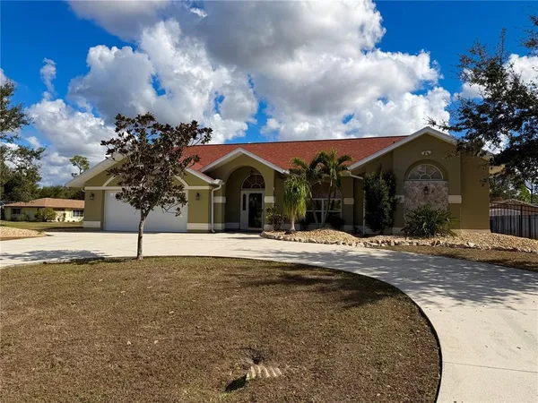 a view of a house with a yard