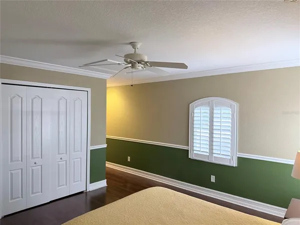 a view of room with window and ceiling fan