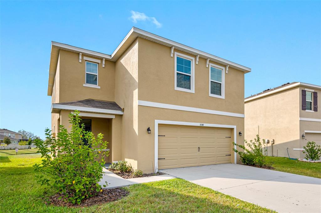 8148 Pelican Reed Circle Wesley Chapel, FL 33545 - Photo 1 of 1 a front view of a house with a yard