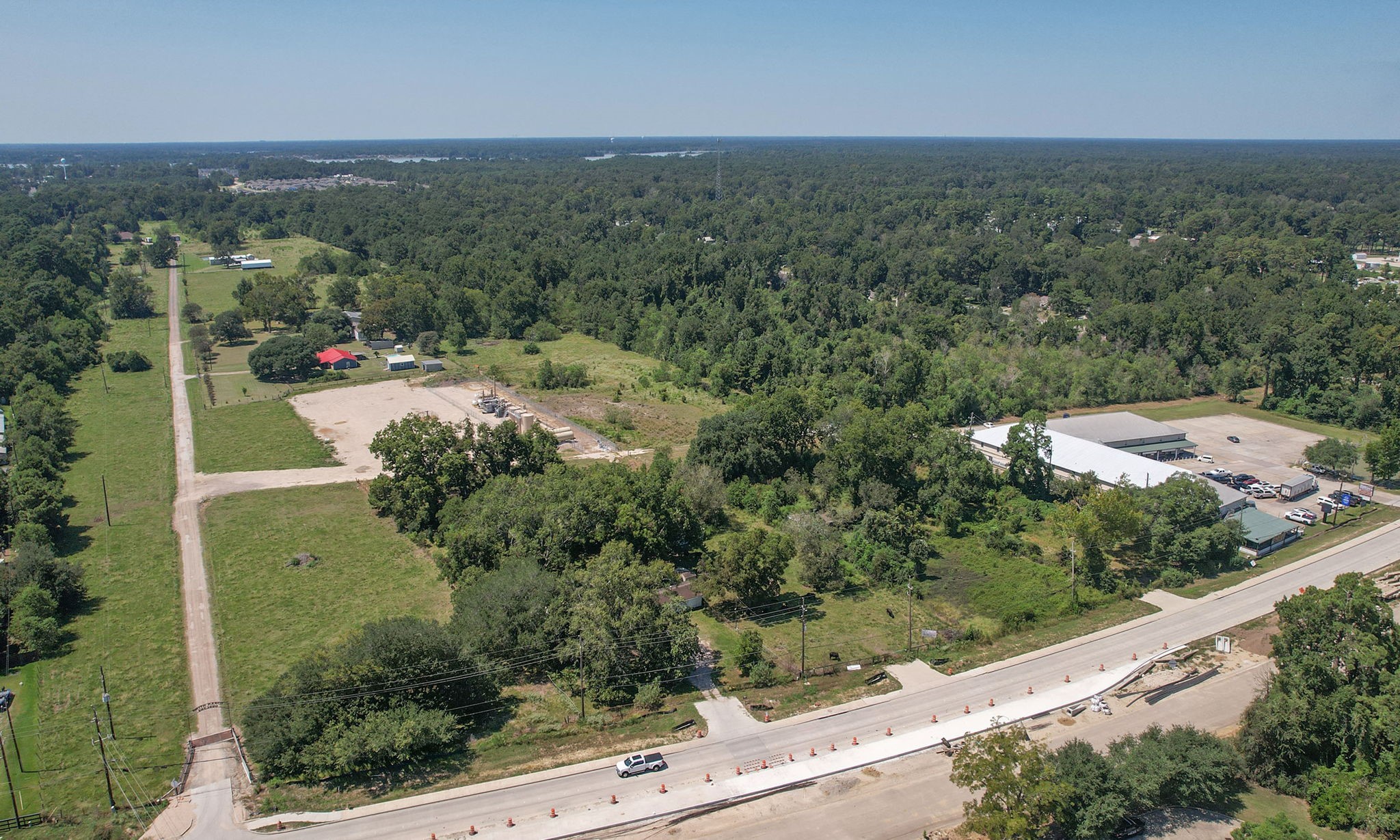 24411 Farm To Market 2100 Huffman, TX 77336 - Photo 11 of 18 an aerial view of a residential houses with outdoor space and street view