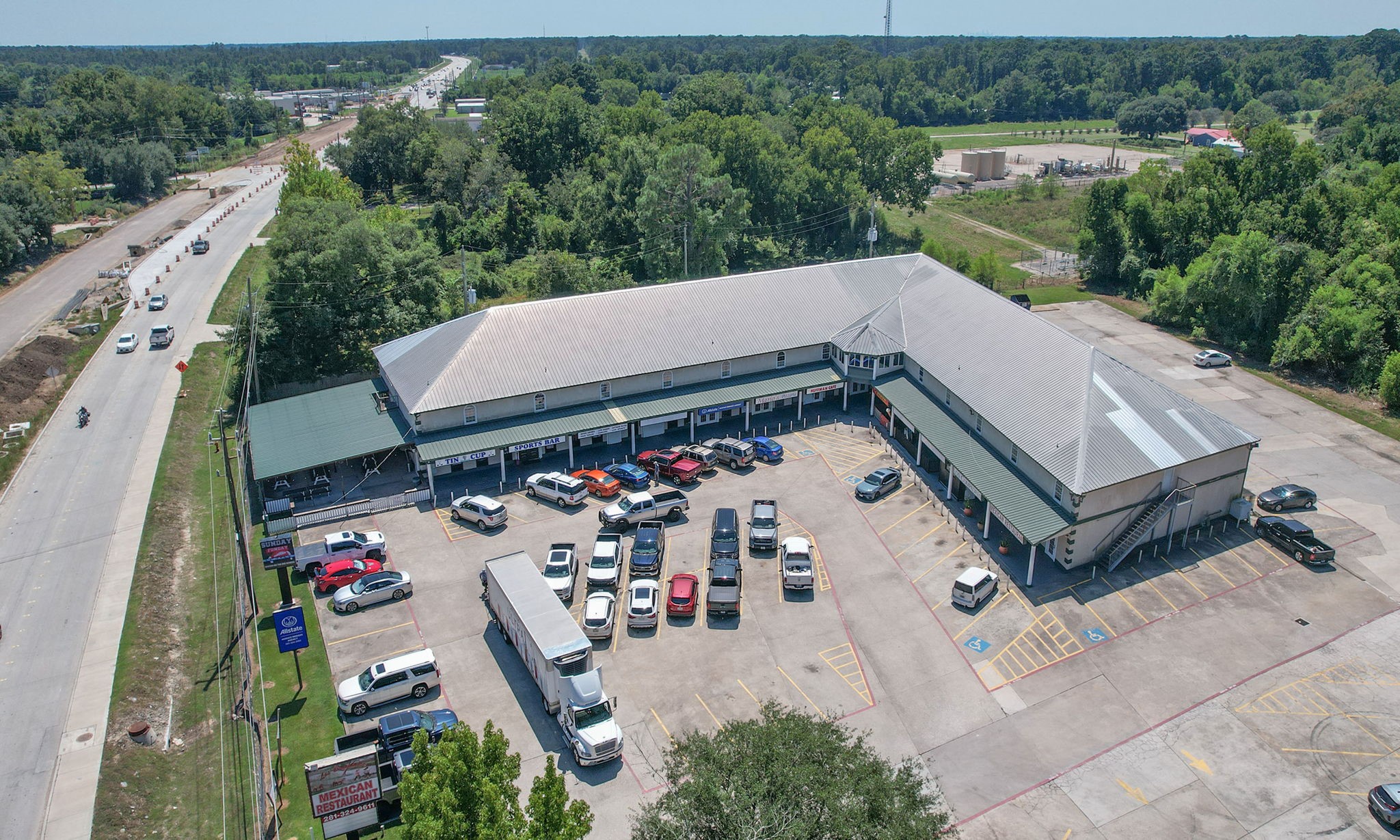 24411 Farm To Market 2100 Huffman, TX 77336 - Photo 18 of 18 an aerial view of a house