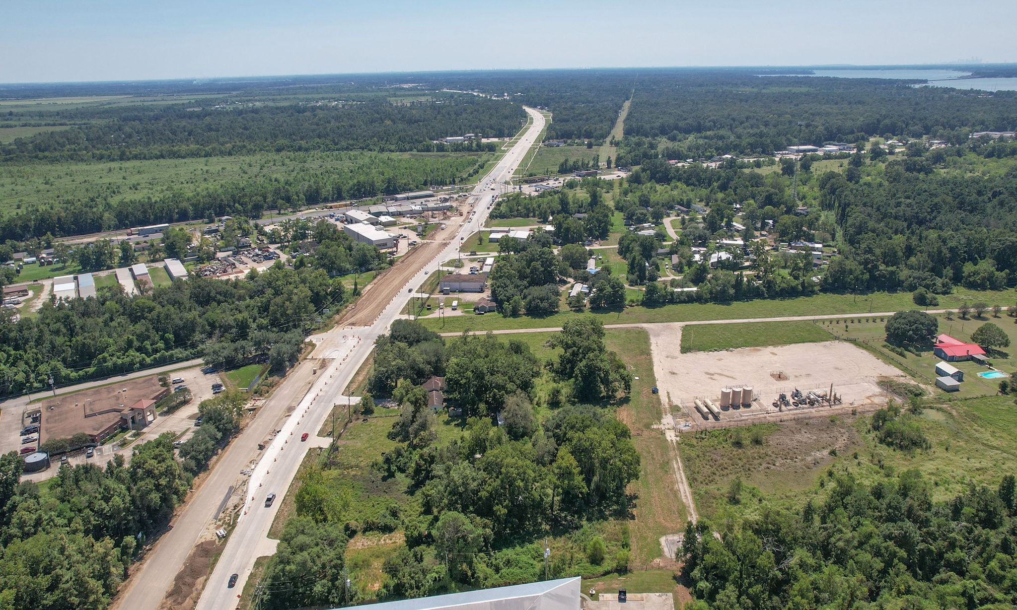 24411 Farm To Market 2100 Huffman, TX 77336 - Photo 8 of 18 an aerial view of a house with a yard lake view and mountain view in back