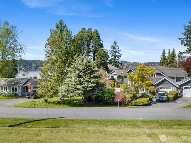 a view of a street with benches in the background