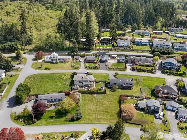 a aerial view of a house with swimming pool and garden