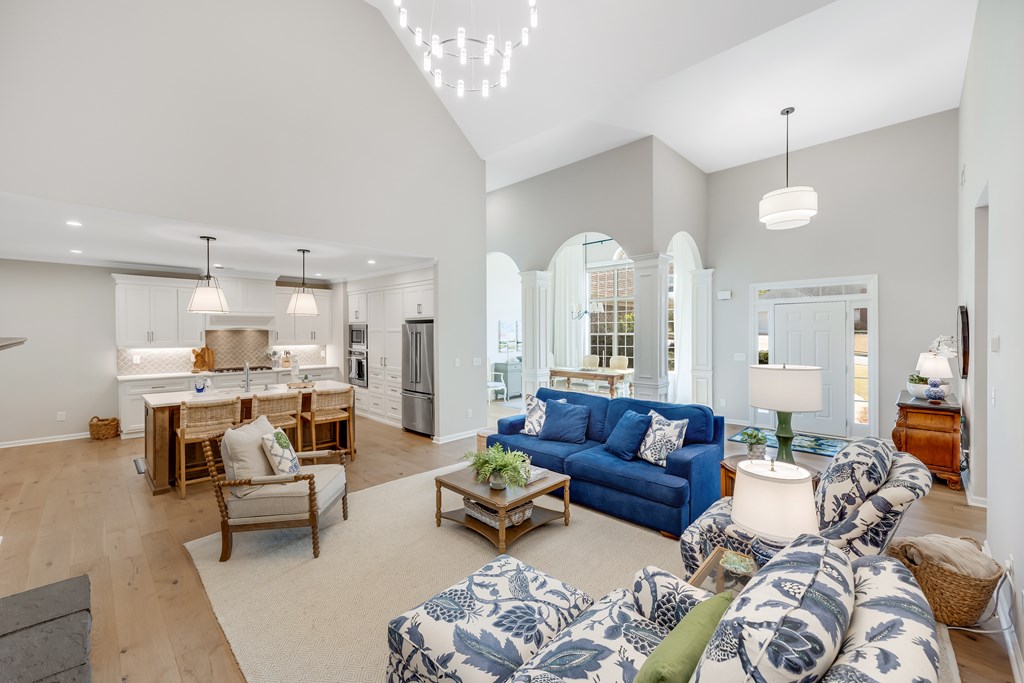6712 Bridge Way Columbus, GA 31904 - Photo 7 of 36 a living room with furniture and a chandelier
