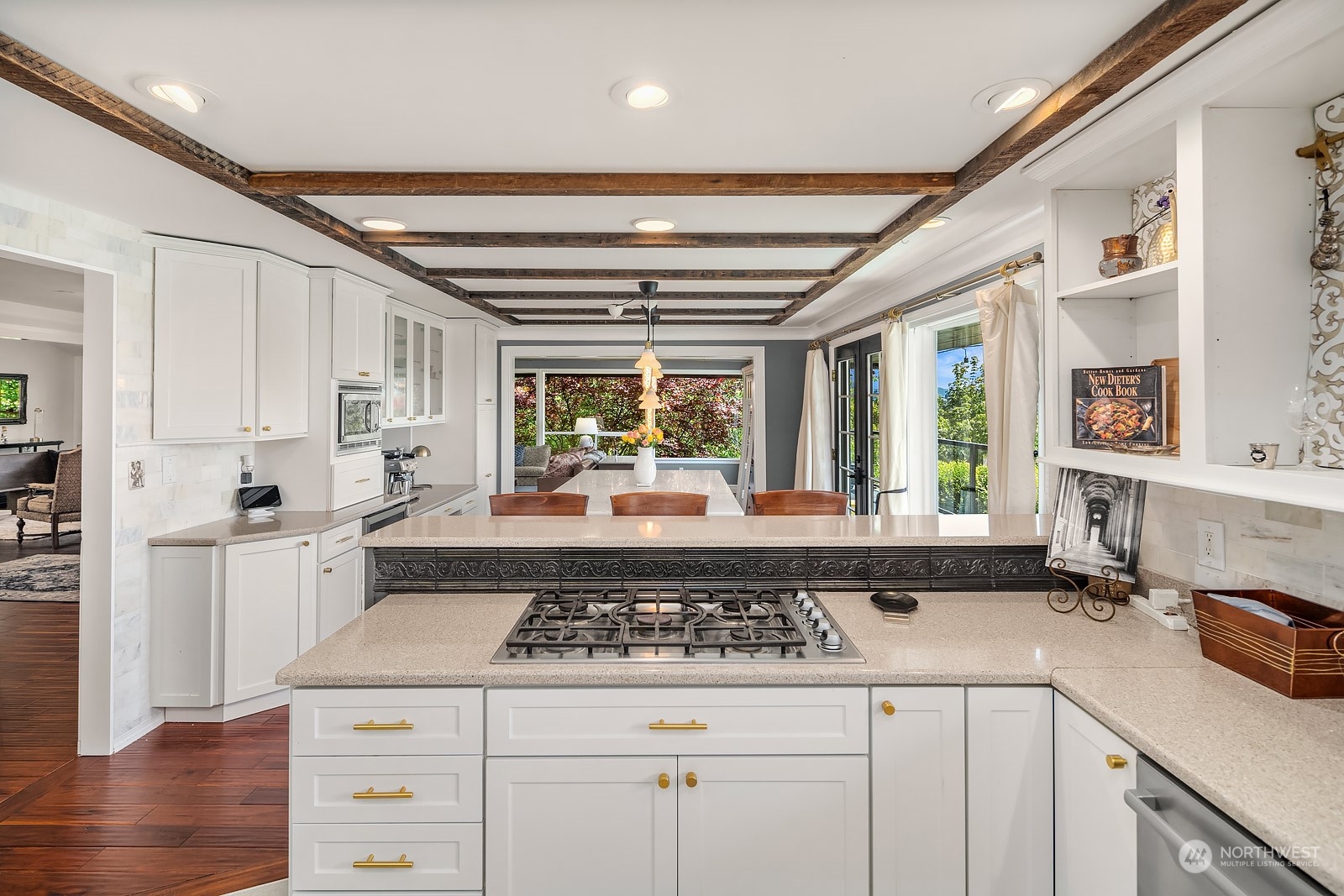 16404 9th Avenue Southwest Burien, WA 98166 - Photo 14 of 40 a kitchen with a stove and white cabinets