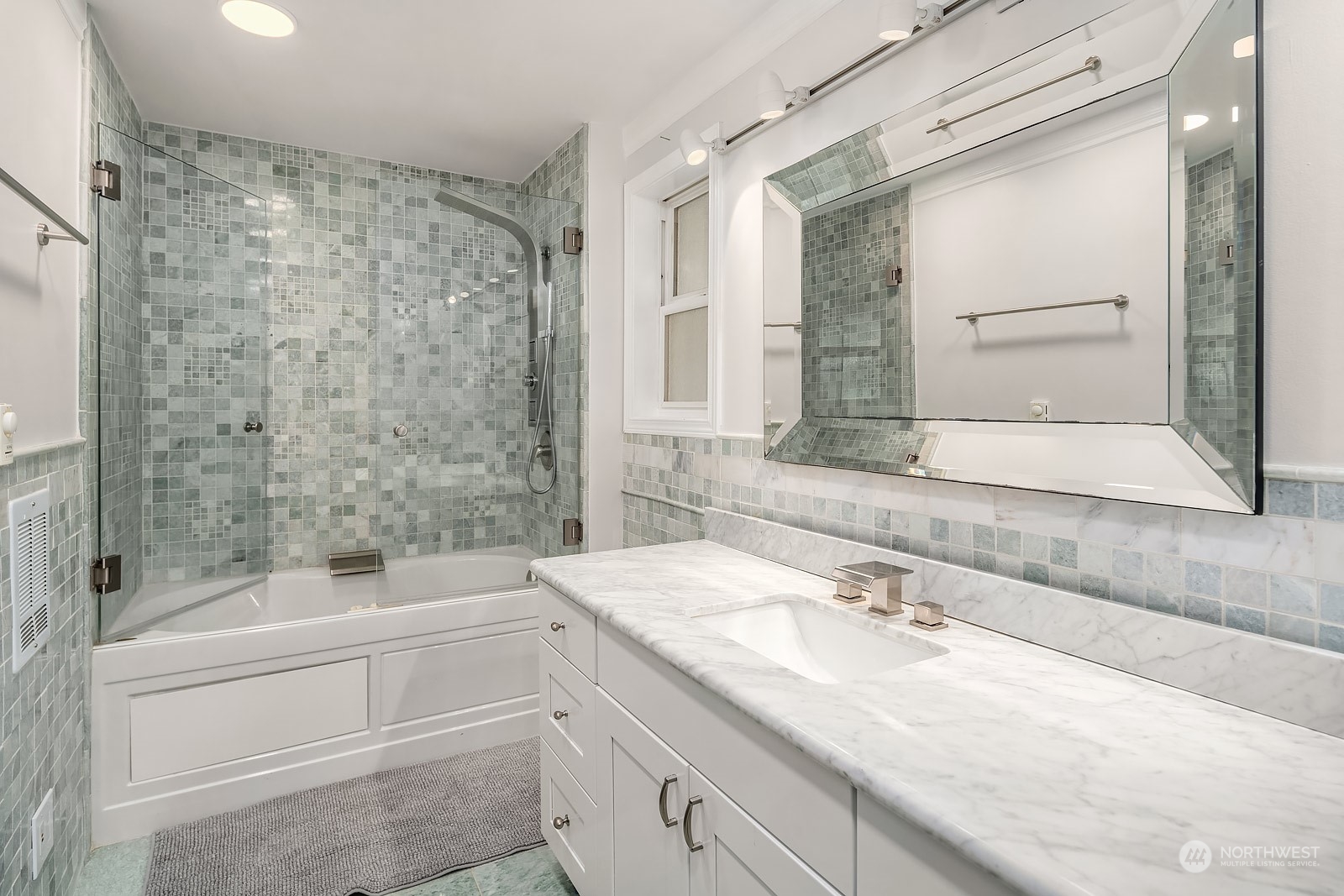 16404 9th Avenue Southwest Burien, WA 98166 - Photo 23 of 40 a bathroom with a granite countertop sink a toilet and shower