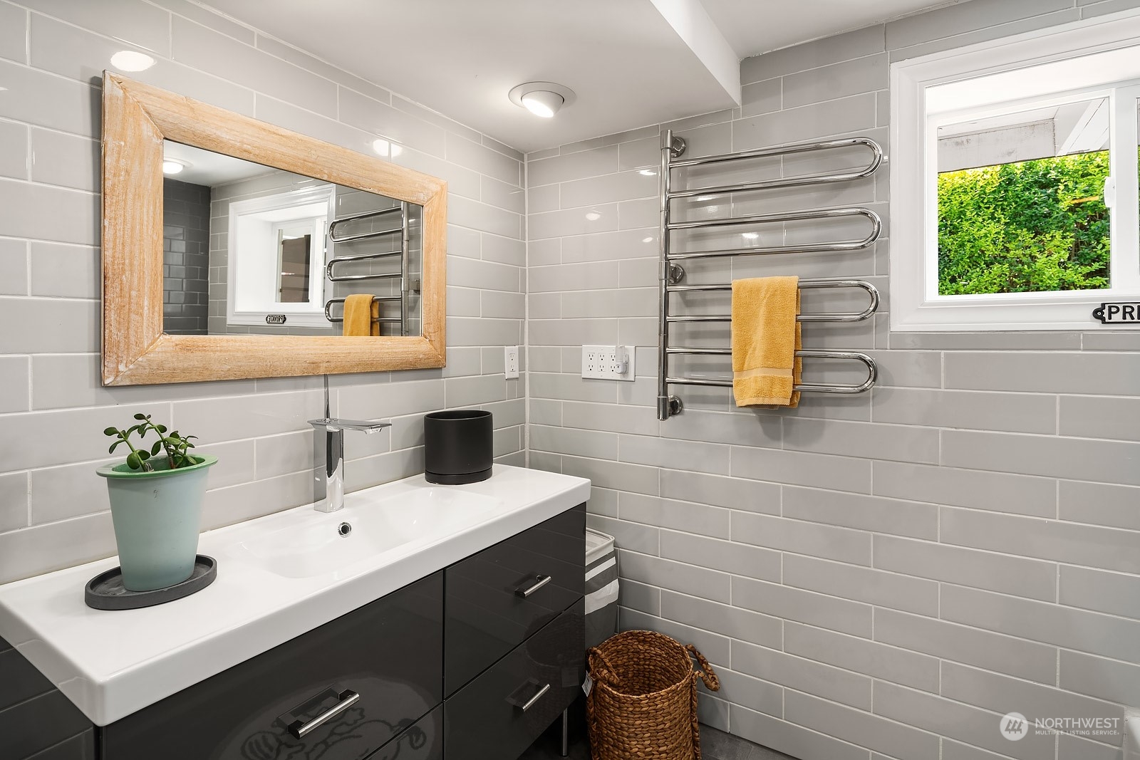 16404 9th Avenue Southwest Burien, WA 98166 - Photo 31 of 40 a bathroom with a sink a toilet and mirror