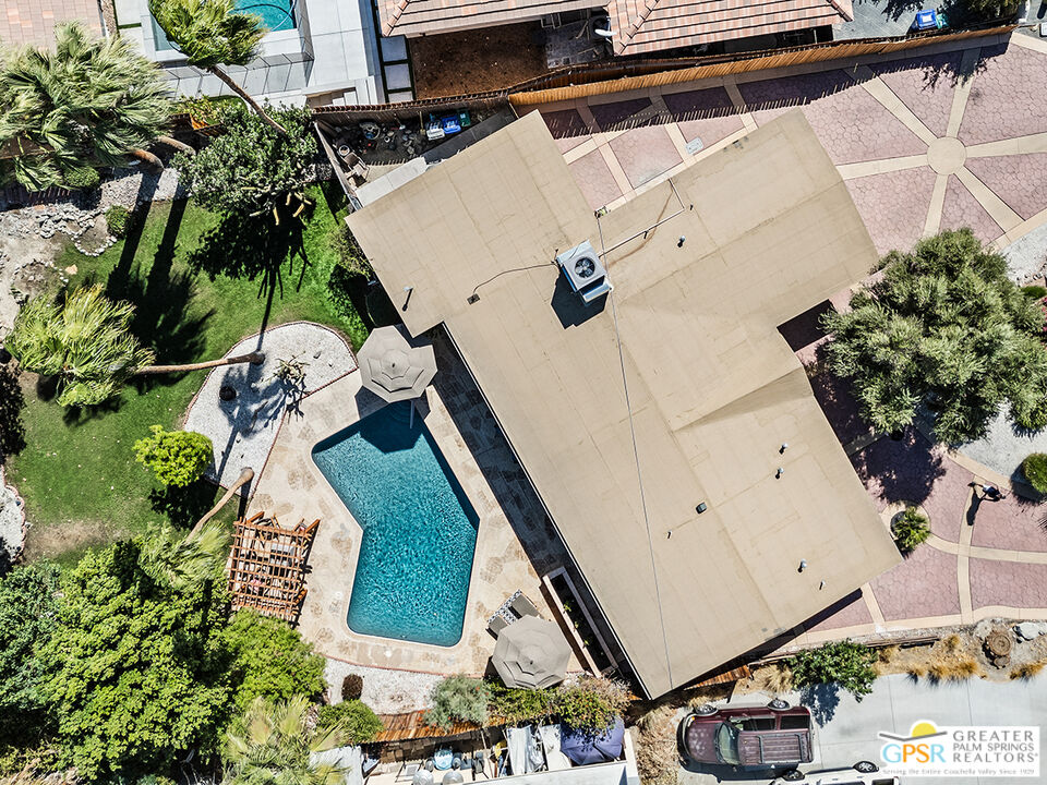 71748 San Gorgonio Road Rancho Mirage, CA 92270 - Photo 1 of 2 an aerial view of a house with a yard and potted plants