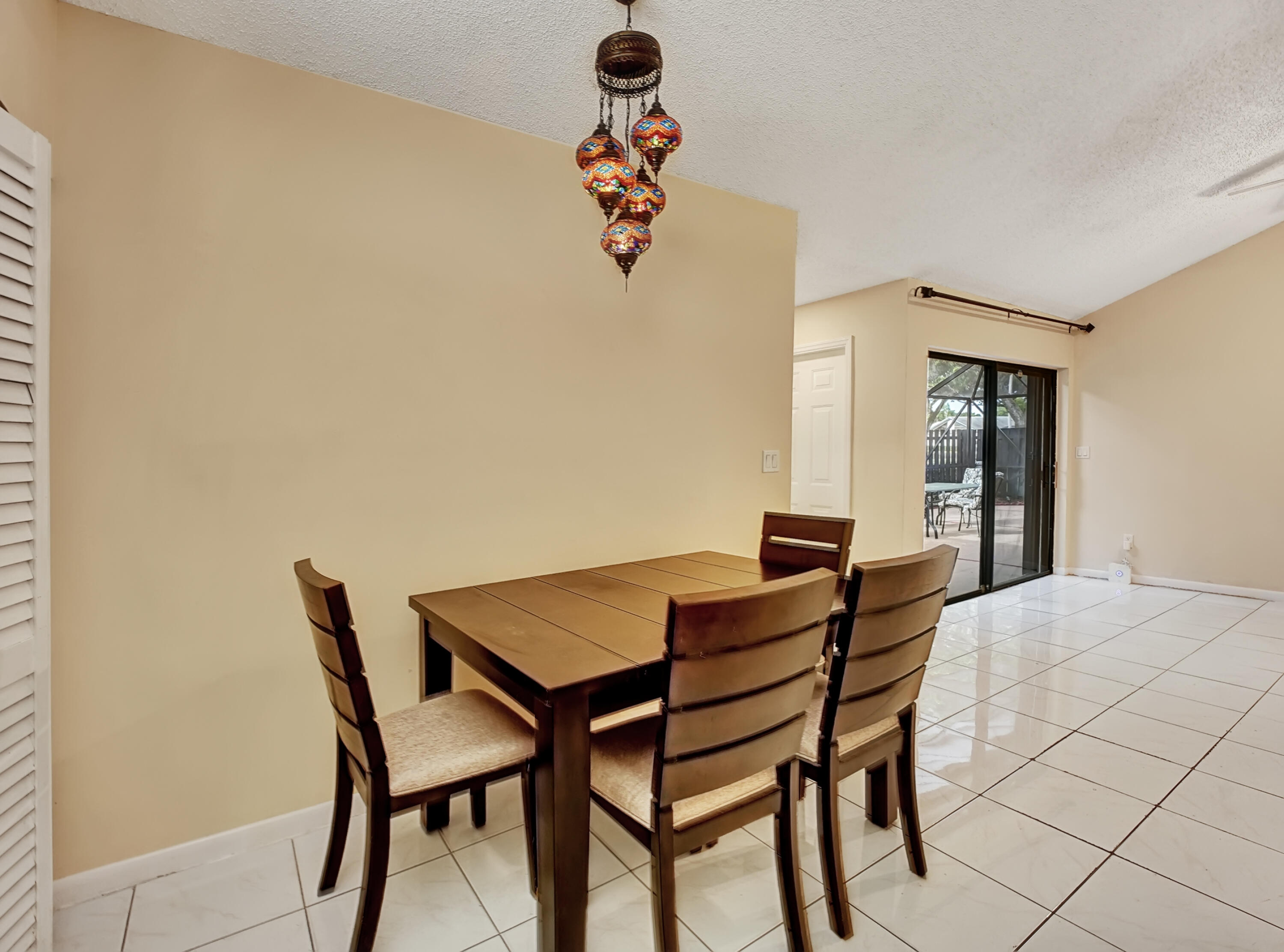 1165 Summit Trail Circle, Unit A West Palm Beach, FL 33415 - Photo 13 of 37 a view of a dining room with furniture and wooden floor