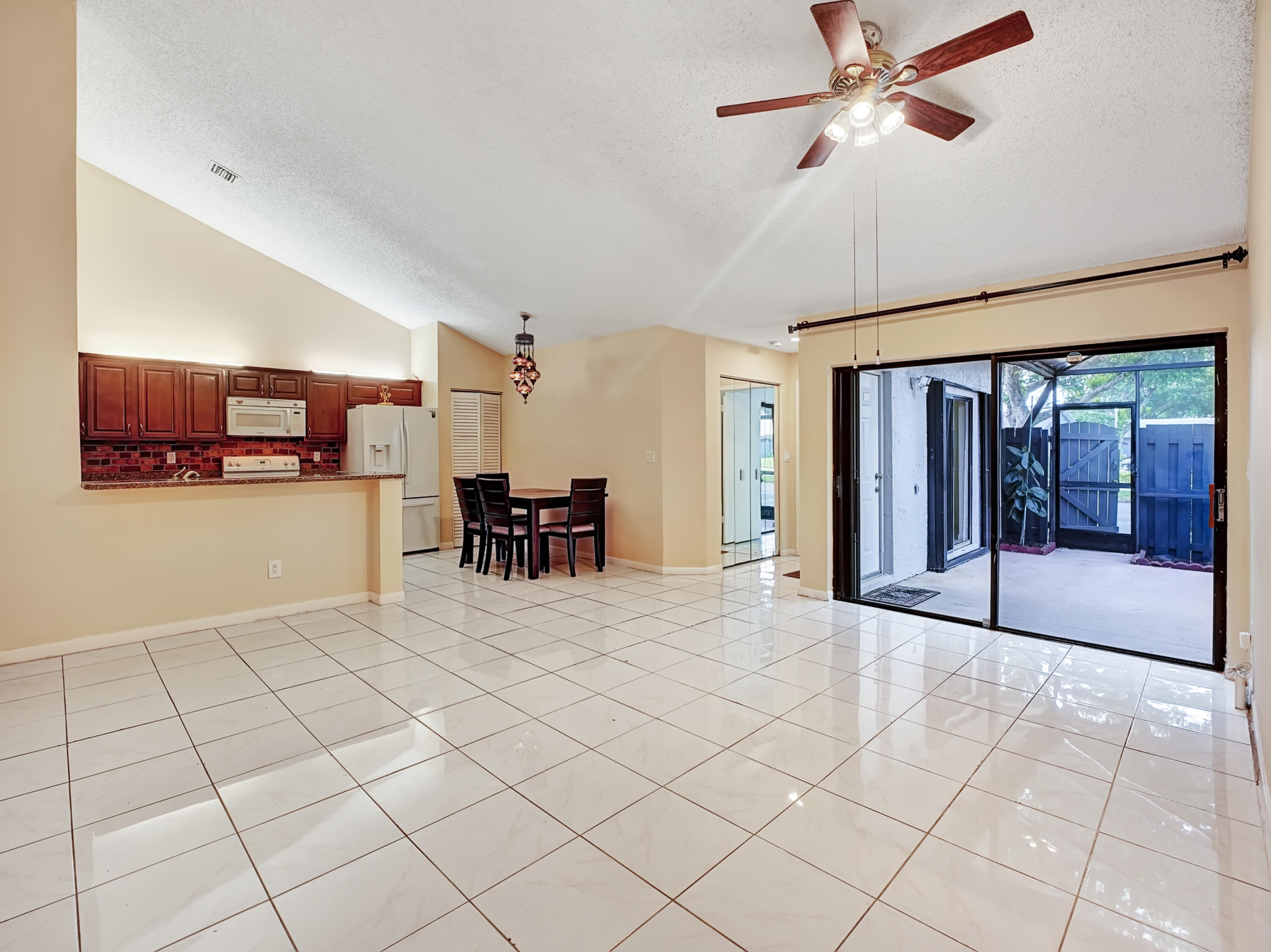 1165 Summit Trail Circle, Unit A West Palm Beach, FL 33415 - Photo 14 of 37 a view of a livingroom with furniture and a ceiling fan