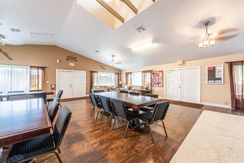 1165 Summit Trail Circle, Unit A West Palm Beach, FL 33415 - Photo 28 of 37 a view of a dining room with furniture and wooden floor