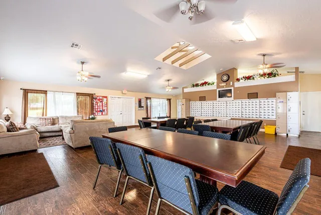 a living room with dining table and a couch