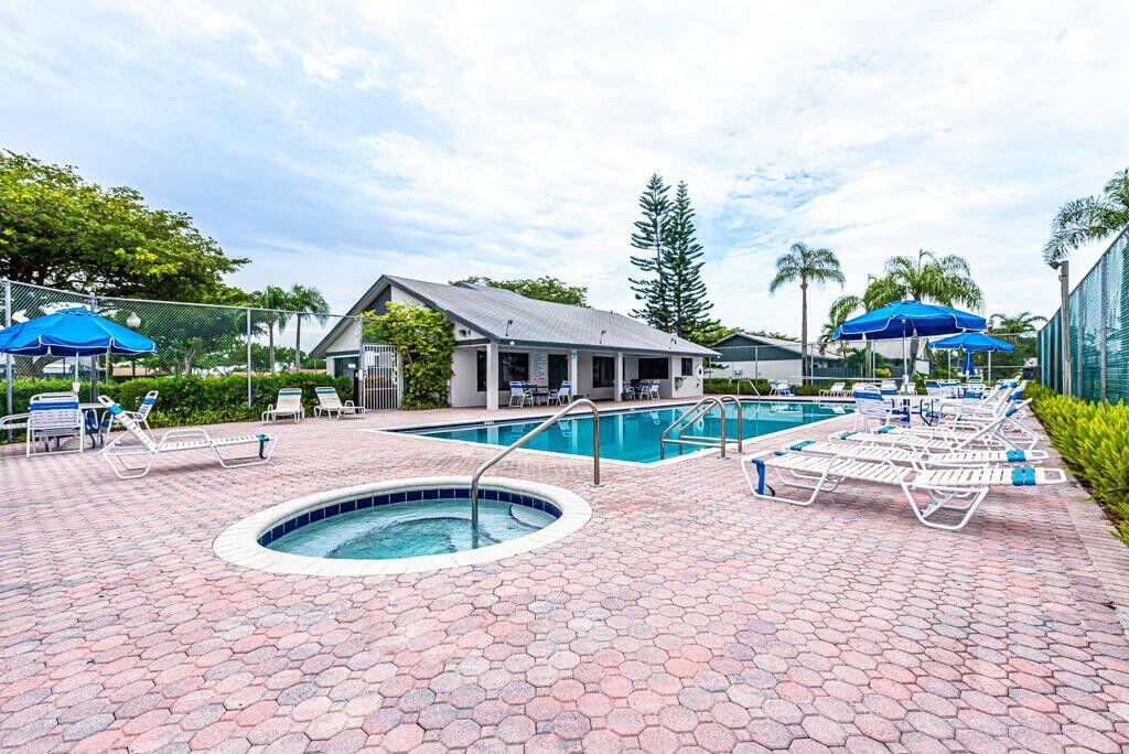 1165 Summit Trail Circle, Unit A West Palm Beach, FL 33415 - Photo 32 of 37 a front view of house with yard swimming pool and furniture