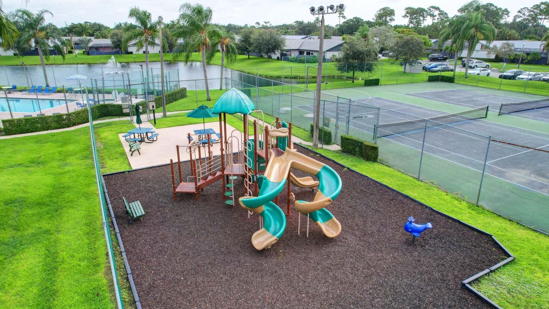 1165 Summit Trail Circle, Unit A West Palm Beach, FL 33415 - Photo 34 of 37 a view of a park with slide