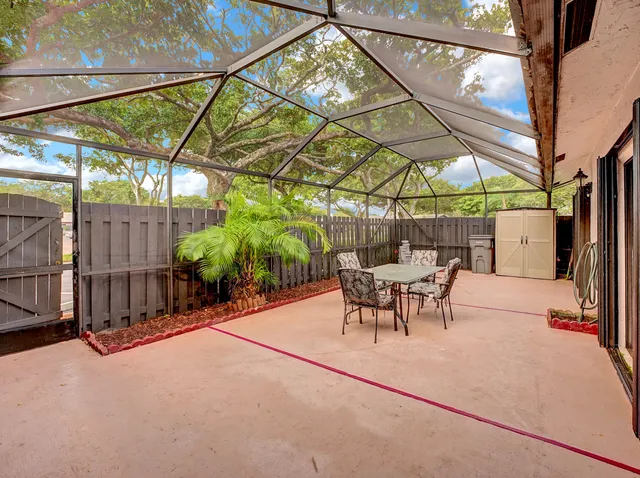 a view of outdoor space with table and chairs