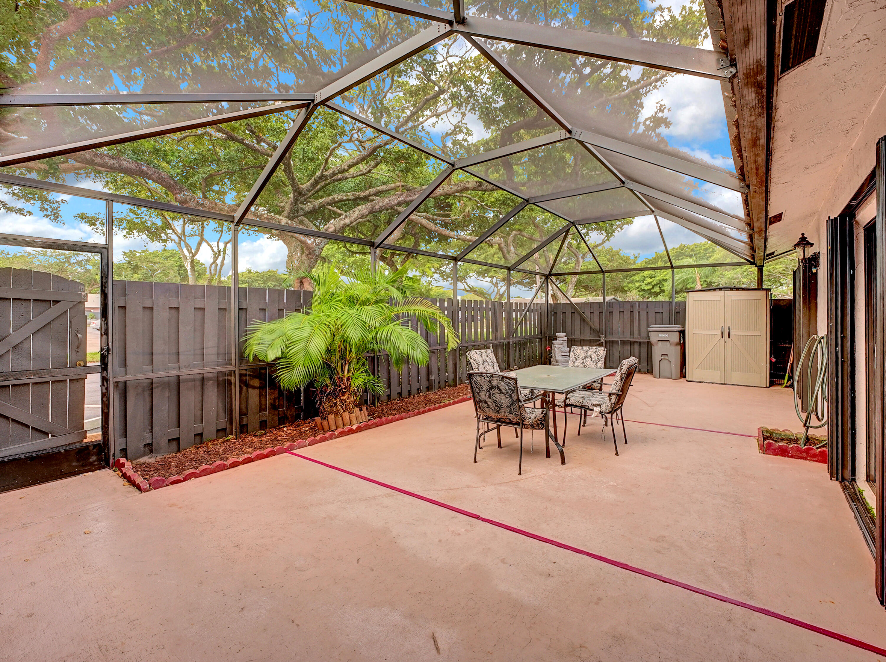 1165 Summit Trail Circle, Unit A West Palm Beach, FL 33415 - Photo 4 of 37 a view of outdoor space with table and chairs