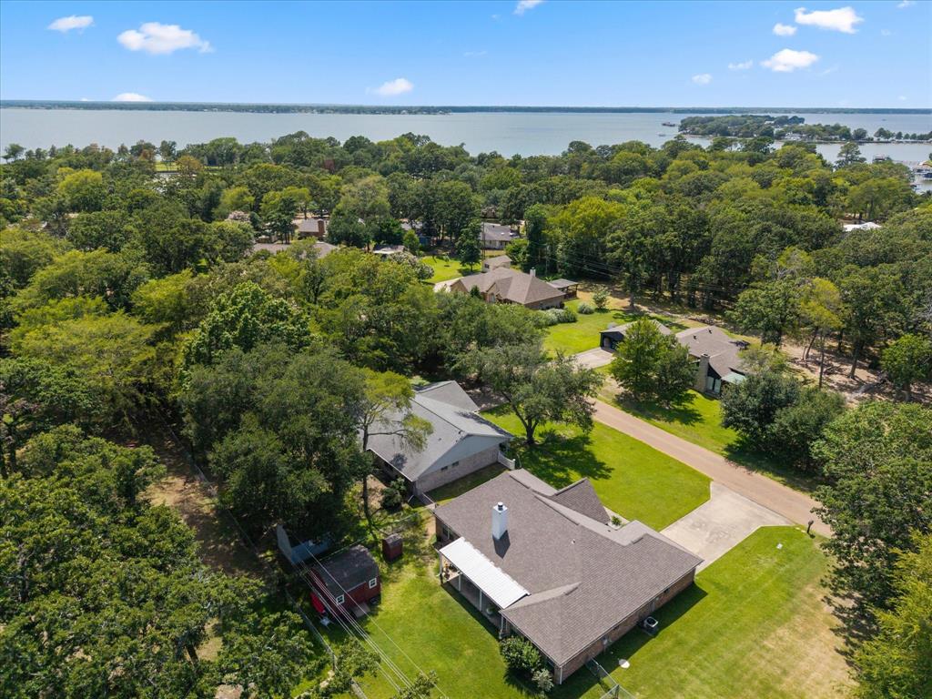 116 Meadowood Road Enchanted Oaks, TX 75156 - Photo 29 of 37 Aerial property showcasing a shingle roof and a concrete driveway