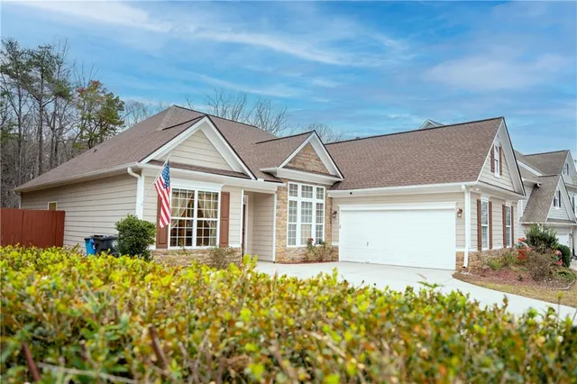 front view of a house with a yard