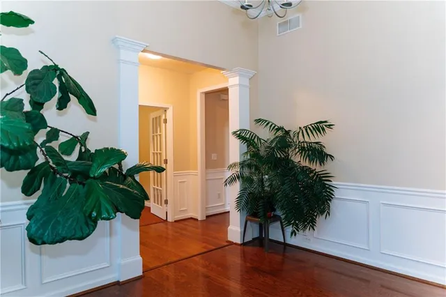 a vase of flowers sitting on a table in a room