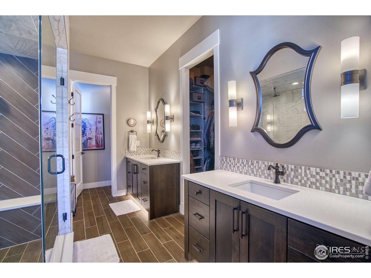 3941 Roper Trail Severance, CO 80524 - Photo 15 of 32 a bathroom with a sink vanity and a mirror