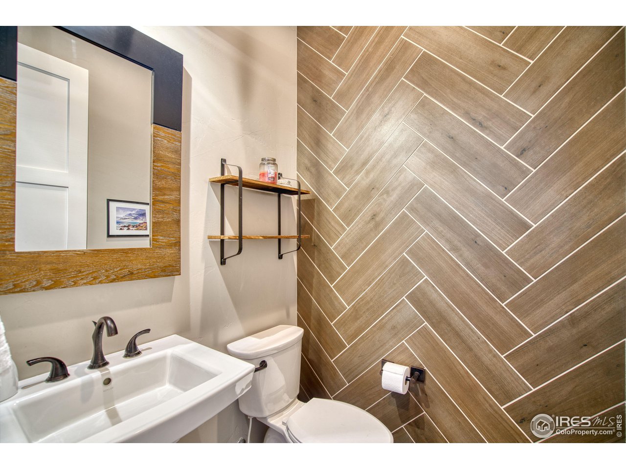 3941 Roper Trail Severance, CO 80524 - Photo 18 of 32 a bathroom with a sink toilet and shower