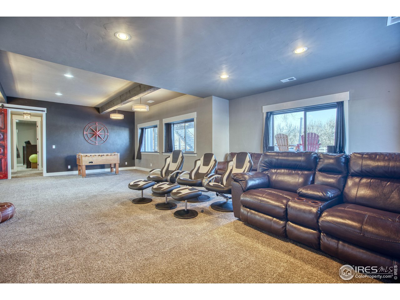3941 Roper Trail Severance, CO 80524 - Photo 19 of 32 a living room with furniture window and couch