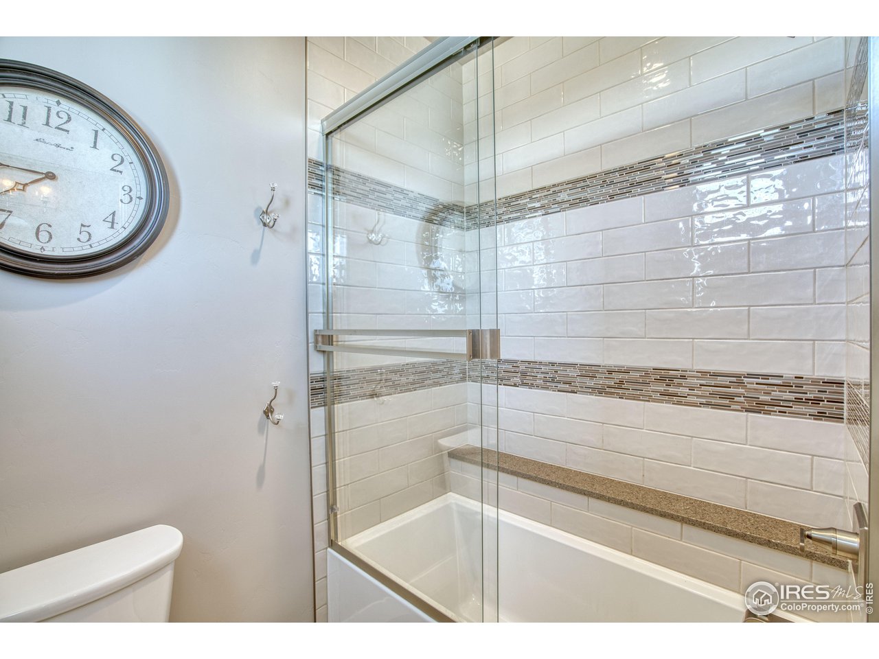 3941 Roper Trail Severance, CO 80524 - Photo 21 of 32 a bathroom with a shower and a toilet
