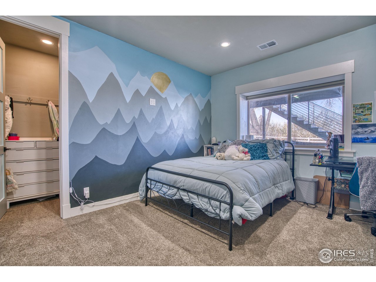 3941 Roper Trail Severance, CO 80524 - Photo 23 of 32 a bedroom with a bed and a dresser