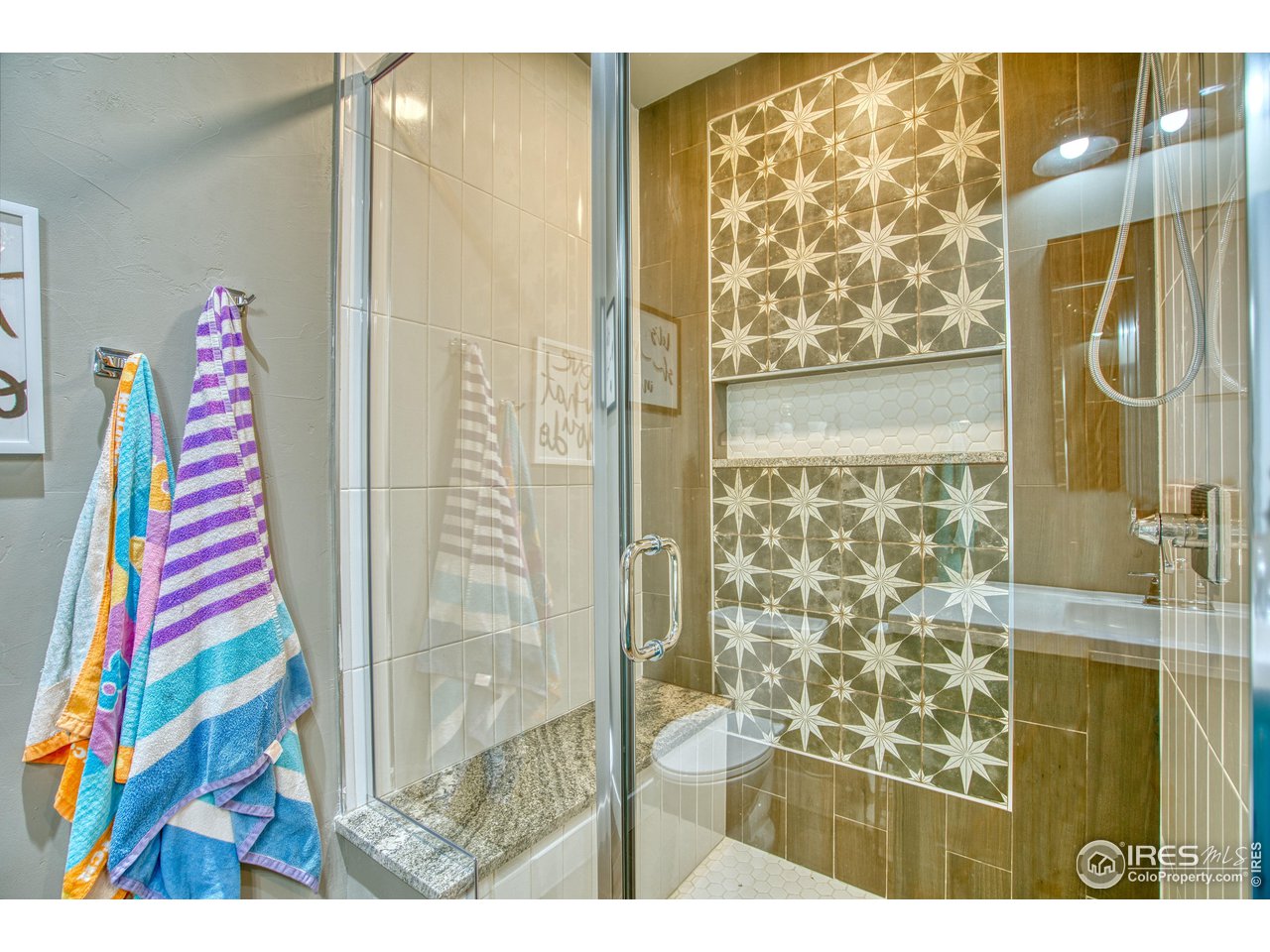 3941 Roper Trail Severance, CO 80524 - Photo 24 of 32 a living room with a rug and a wooden floor