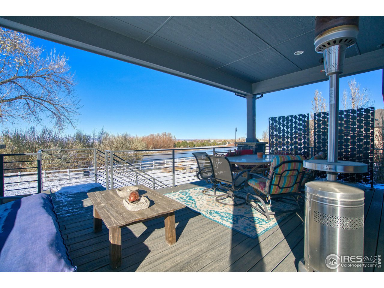 3941 Roper Trail Severance, CO 80524 - Photo 29 of 32 a terrace of a house with outdoor seating