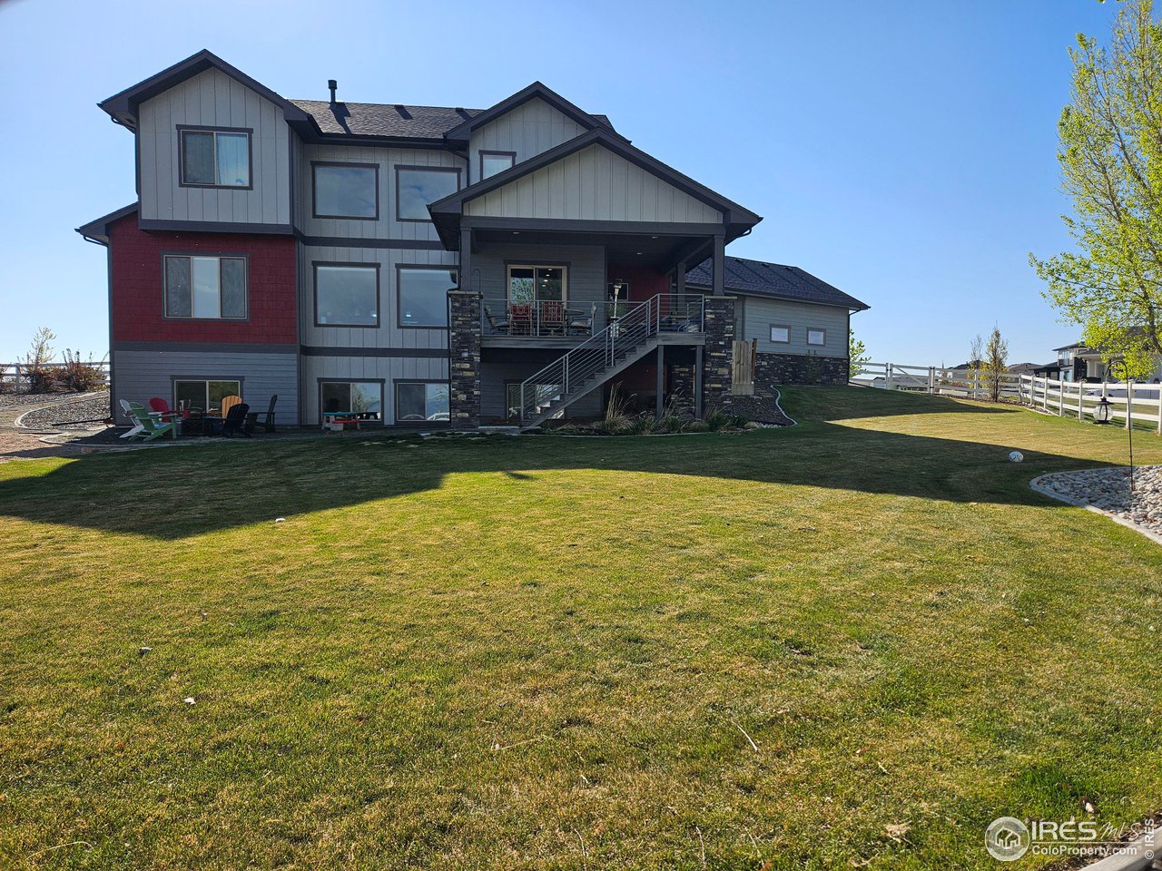 3941 Roper Trail Severance, CO 80524 - Photo 30 of 32 a front view of a house with swimming pool having outdoor seating