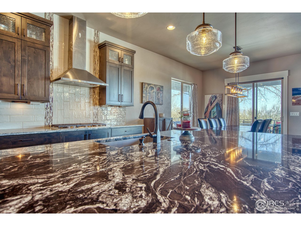 3941 Roper Trail Severance, CO 80524 - Photo 7 of 32 a view of a swimming pool and dining room