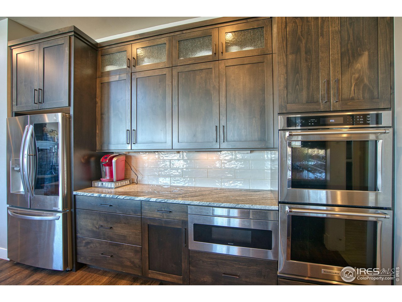 3941 Roper Trail Severance, CO 80524 - Photo 10 of 32 a kitchen with appliances and cabinets
