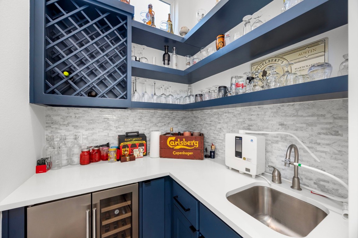 424 Redan Street Houston, TX 77009 - Photo 12 of 47 a kitchen with a sink and cabinets